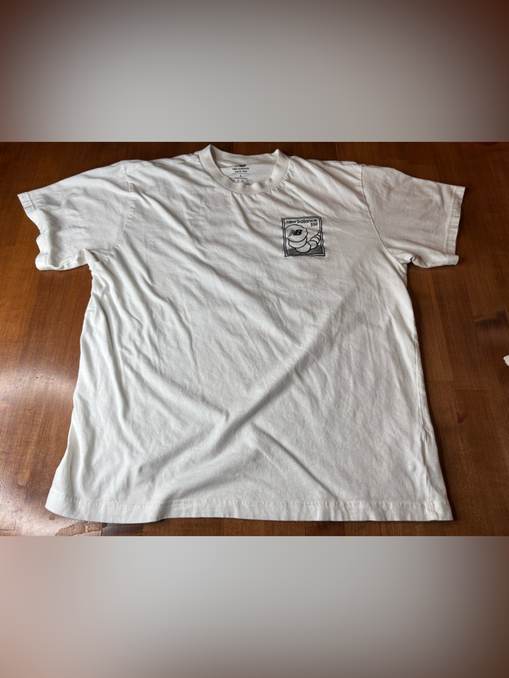 New Balance White Short-Sleeve Crewneck T-Shirt with Black Pocket Graphic